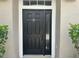 Stylish front door with sidelight and transom window welcomes you home at 6416 S Goldenrod Rd # 8A, Orlando, FL 32822