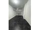 Spacious garage featuring sealed flooring, bright lighting and automatic door opener at 6416 S Goldenrod Rd # 8A, Orlando, FL 32822