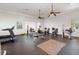 A fitness center with various exercise machines and ceiling fans at 6416 S Goldenrod Rd # 8A, Orlando, FL 32822