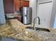 Beautiful granite countertops in a well-appointed kitchen with stainless appliances at 6416 S Goldenrod Rd # 8A, Orlando, FL 32822