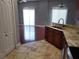 Kitchen sink with granite countertops and stainless steel appliances nearby at 6416 S Goldenrod Rd # 8A, Orlando, FL 32822