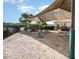 Community playground featuring colorful play structures under a sunshade at 6416 S Goldenrod Rd # 8A, Orlando, FL 32822