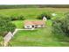 Aerial view of home with bright green lawn and shed in backyard at 6720 Midland Drive, St Cloud, FL 34771