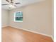 This bedroom features wood-look flooring and a window for natural light at 6720 Midland Drive, St Cloud, FL 34771