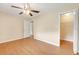 Bedroom features ceiling fan, neutral paint, and a closet at 6720 Midland Drive, St Cloud, FL 34771