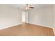Bright bedroom features wood-look flooring, neutral walls, and a ceiling fan at 6720 Midland Drive, St Cloud, FL 34771