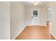 Light and airy entryway with wood flooring and a white door at 6720 Midland Drive, St Cloud, FL 34771