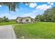 A charming single-story home with green shutters and a well-manicured lawn at 6720 Midland Drive, St Cloud, FL 34771