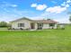 Charming single-story home features green shutters, landscaped yard and a well-maintained lawn at 6720 Midland Drive, St Cloud, FL 34771