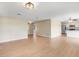 Open-concept living room and kitchen area with modern lighting at 6720 Midland Drive, St Cloud, FL 34771