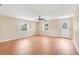 Spacious living room with new floors, neutral paint, ceiling fan, and natural light at 6720 Midland Drive, St Cloud, FL 34771