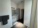 Bright bathroom featuring gray vanity, a marble countertop and stylish fixtures at 862 Bowden Rd, The Villages, FL 32163