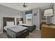 Bedroom with two twin beds, colorful decor, and natural light from a window at 8977 Majesty Palm Rd, Kissimmee, FL 34747
