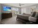 Bright primary bedroom features a beachy view and a large dresser with decorative vases at 8977 Majesty Palm Rd, Kissimmee, FL 34747
