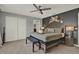 Charming bedroom featuring a decorative headboard wall and ensuite bathroom entrance at 8977 Majesty Palm Rd, Kissimmee, FL 34747