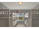 Bright bunk bedroom features two twin beds and a bright window view at 8977 Majesty Palm Rd, Kissimmee, FL 34747