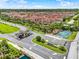 Community entrance with attractive landscaping, waterfall feature and guardhouse at 8977 Majesty Palm Rd, Kissimmee, FL 34747
