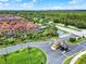Beautifully landscaped community entrance with a guard house and water feature at 8977 Majesty Palm Rd, Kissimmee, FL 34747