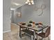 Dining area featuring a dining table with seating and stylish Mickey Mouse inspired wall art at 8977 Majesty Palm Rd, Kissimmee, FL 34747