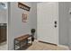 Charming entryway featuring a bench, coat rack, and bright white door at 8977 Majesty Palm Rd, Kissimmee, FL 34747