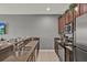 Well-equipped kitchen with stainless steel appliances, breakfast bar, and ample counter space at 8977 Majesty Palm Rd, Kissimmee, FL 34747