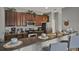 Modern kitchen with stainless steel appliances, a breakfast bar and stylish decor on the cabinets at 8977 Majesty Palm Rd, Kissimmee, FL 34747