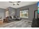 Comfortable living room showcasing a sectional sofa, neutral paint, and decorative elements for a cozy atmosphere at 8977 Majesty Palm Rd, Kissimmee, FL 34747