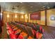 Community movie theatre room with tiered seating and large screen at 8977 Majesty Palm Rd, Kissimmee, FL 34747