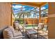 Relaxing screened-in pool patio with comfortable seating overlooking the sparkling pool at 8977 Majesty Palm Rd, Kissimmee, FL 34747