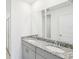 Bathroom featuring double sink vanity with granite counters and updated fixtures at 903 Donahue Pass, Lake Hamilton, FL 33851