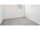 Compact and carpeted bedroom with a window offering natural light at 903 Donahue Pass, Lake Hamilton, FL 33851