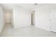 A bright entryway with tiled floors and clean, neutral walls leads to various rooms, offering a welcoming first impression at 903 Donahue Pass, Lake Hamilton, FL 33851