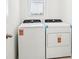 Bright laundry room area features a new washer and dryer ready to be used at 903 Donahue Pass, Lake Hamilton, FL 33851