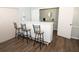 Clubhouse bar area with three stools, ample counter space, and a sink at 954 Courtyard Ln # 52, Orlando, FL 32825