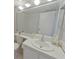 Well-lit bathroom with a large mirror over the vanity at 954 Courtyard Ln # 52, Orlando, FL 32825