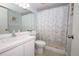 Bathroom featuring a vanity, toilet, mirror, and a shower with patterned curtain at 954 Courtyard Ln # 52, Orlando, FL 32825