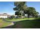 Scenic community featuring walking paths, lush lawns, and mature trees at 954 Courtyard Ln # 52, Orlando, FL 32825
