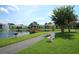 Picturesque community with a pond, fountain, and walking path at 954 Courtyard Ln # 52, Orlando, FL 32825