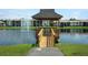 Scenic gazebo on a lake provides a tranquil outdoor space within the community at 954 Courtyard Ln # 52, Orlando, FL 32825