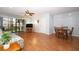 Open floor plan living room with ceiling fan, sliding glass doors and adjacent dining area at 954 Courtyard Ln # 52, Orlando, FL 32825