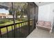 Cozy outdoor patio seating area overlooks lush green landscaping at 954 Courtyard Ln # 52, Orlando, FL 32825