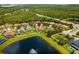 Aerial view of home showcasing the pond view and serene backyard at 9821 Caroline Park Dr, Orlando, FL 32832