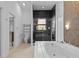 Modern bathroom features a walk-in glass shower and oversized soaking tub at 9821 Caroline Park Dr, Orlando, FL 32832