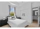 Bright bedroom with a large window and view of the outdoors at 9821 Caroline Park Dr, Orlando, FL 32832