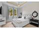 Tastefully decorated bedroom with modern style and ample natural lighting at 9821 Caroline Park Dr, Orlando, FL 32832