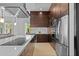 An open-concept kitchen with stainless steel appliances, ample counter space, and modern finishes at 9821 Caroline Park Dr, Orlando, FL 32832