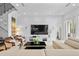 Comfortable living room with natural light, modern furnishings, and access to outdoor living at 9821 Caroline Park Dr, Orlando, FL 32832
