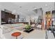 Bright, open living space flows into a modern kitchen with stainless steel appliances and bar seating at 9821 Caroline Park Dr, Orlando, FL 32832