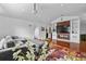 Modern living room featuring a fireplace, built-in shelving and a projector at 9821 Caroline Park Dr, Orlando, FL 32832
