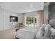 Bright main bedroom with large windows overlooking the pool and outdoor area at 9821 Caroline Park Dr, Orlando, FL 32832